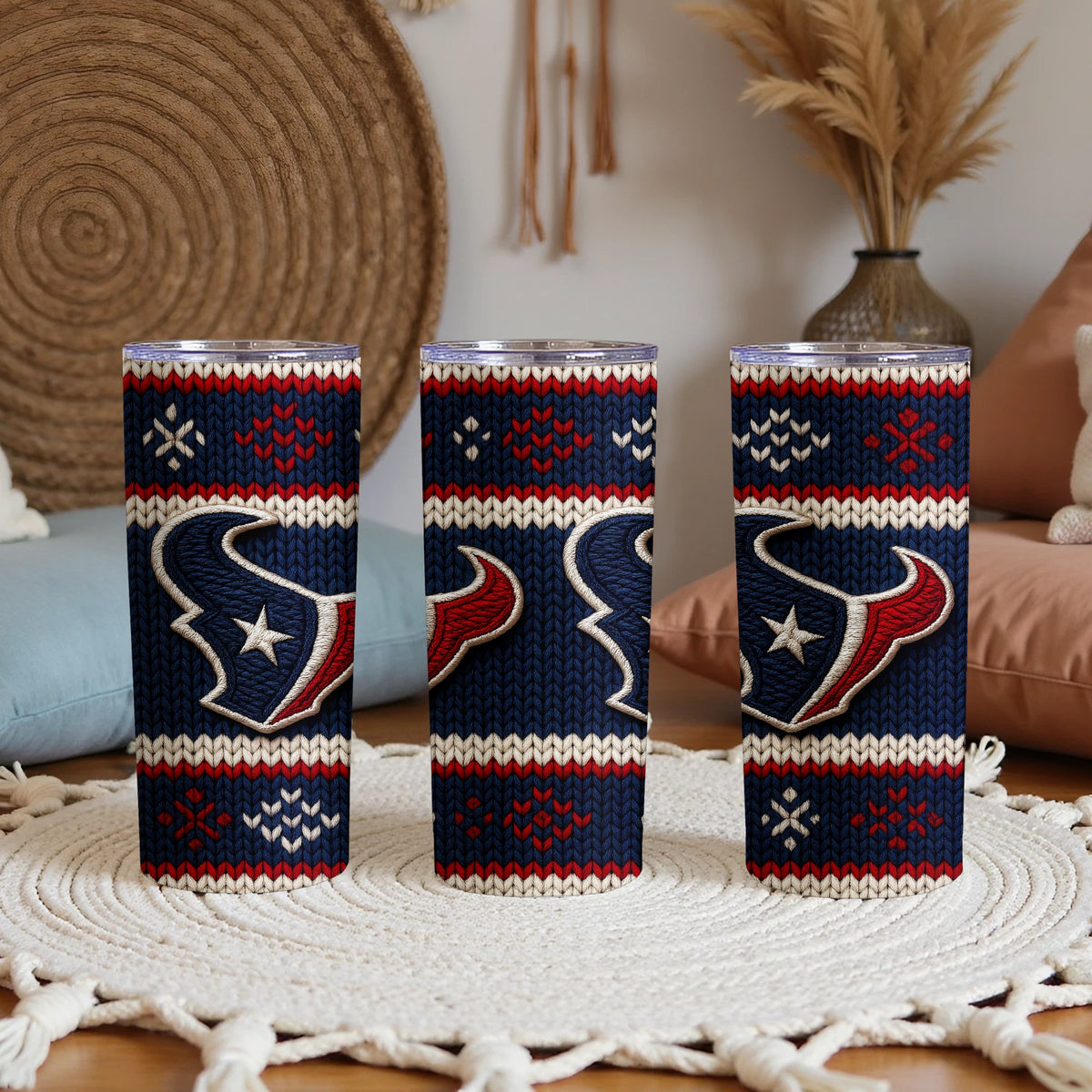 Houston Texans logo on a navy blue, red, and white knit patterned tumbler.