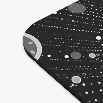 Gray and white circles and dots on a black background, forming rows.