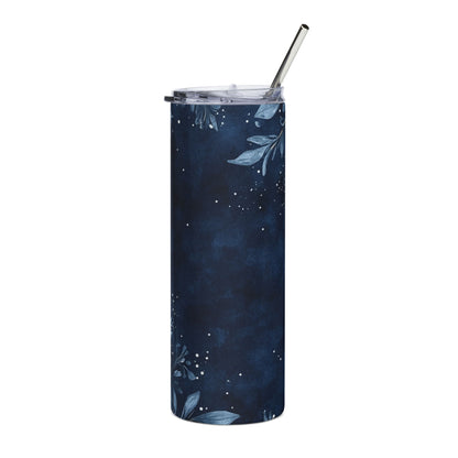 Navy blue tumbler with white floral and star pattern and metal straw.