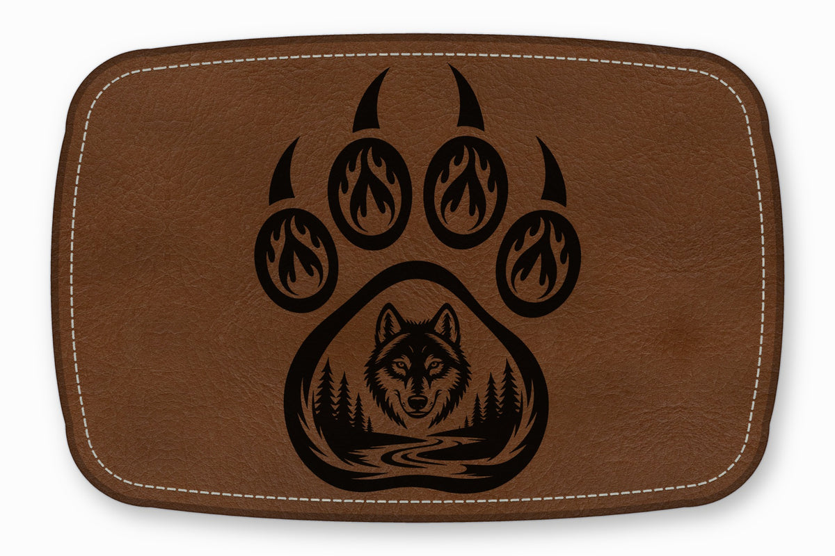 Brown faux leather patch featuring a black bear paw design with flame accents and a wolf forest scene.