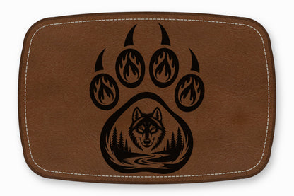 Brown faux leather patch featuring a black bear paw design with flame accents and a wolf forest scene.
