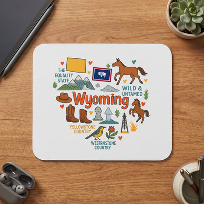 Wyoming mousepad with illustrations of horses, boots, a hat, and Yellowstone geysers.