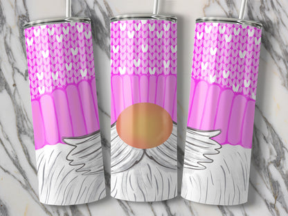 Three pink tumblers with knit pattern and gnome design on marble background.