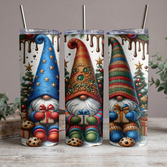Three tumblers decorated with gnomes, Christmas trees, and melting chocolate.