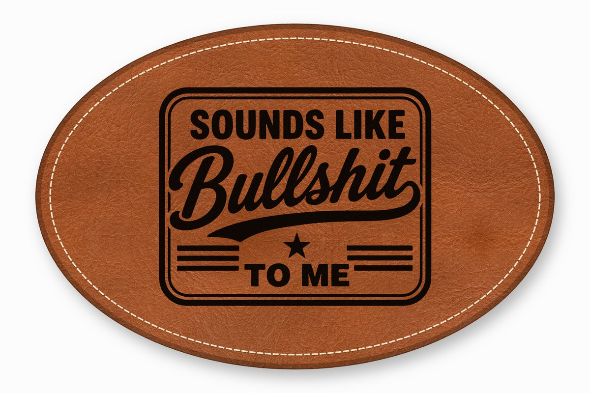 Brown oval leather patch with white stitched border and stamped black text that reads "Sounds Like Bullshit to Me."
