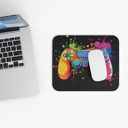 Mousepad with a colorful abstract video game controller design and paint splatters.