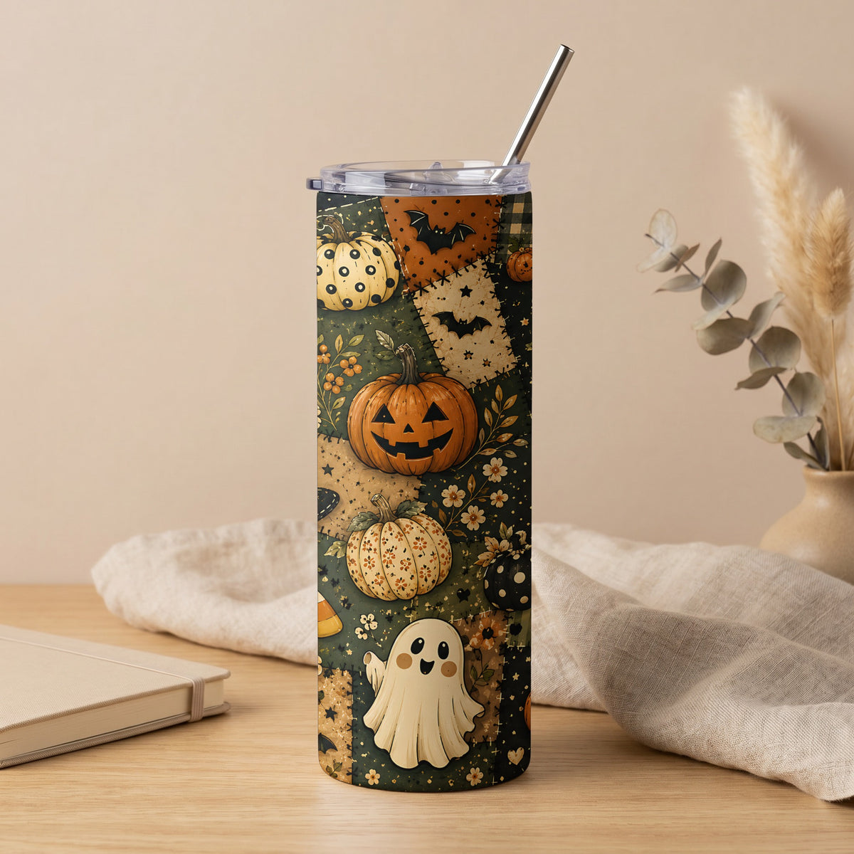 Halloween tumbler with pumpkins, ghost, bat, and candy corn patterns.