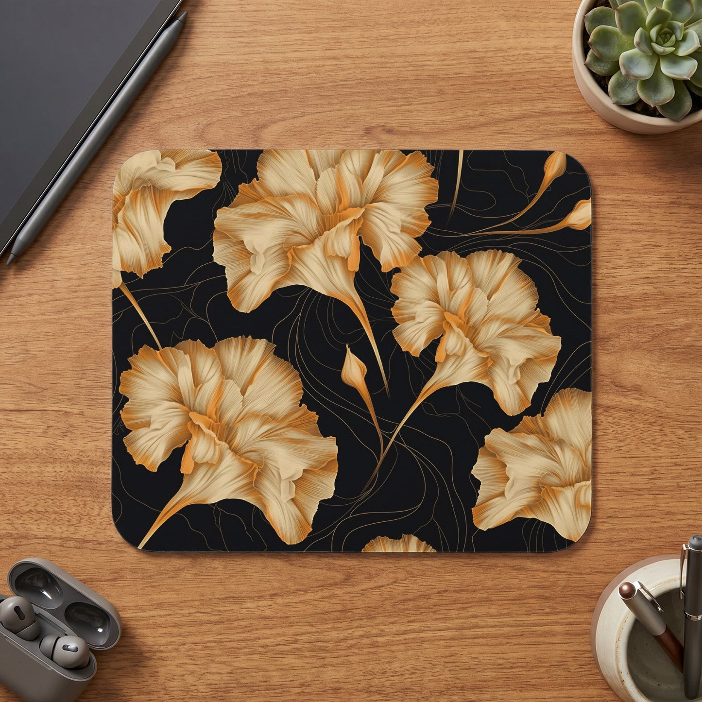 Mousepad with golden floral pattern on black background.