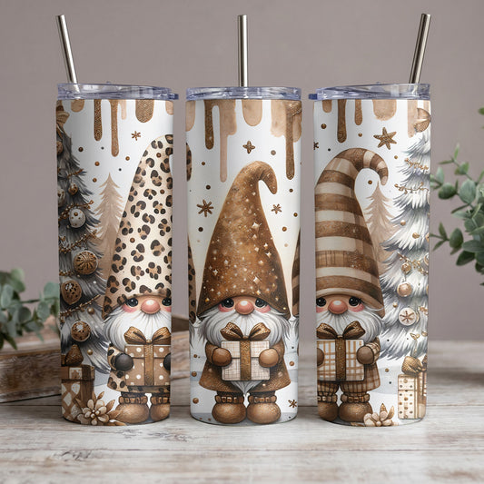 Three tumblers with a gnome, Christmas tree, and gift design in shades of brown and gold.