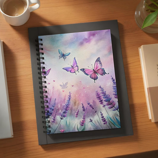 Spiral bound notebook with watercolor butterflies and lavender flowers on the cover.