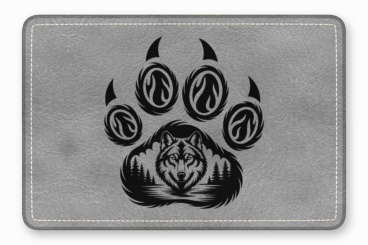 Gray faux leather mousepad featuring a black animal paw print graphic with a wolf and forest design.