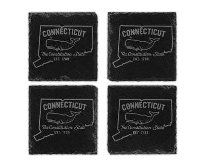 Four slate coasters engraved with the outline of Connecticut and a whale.