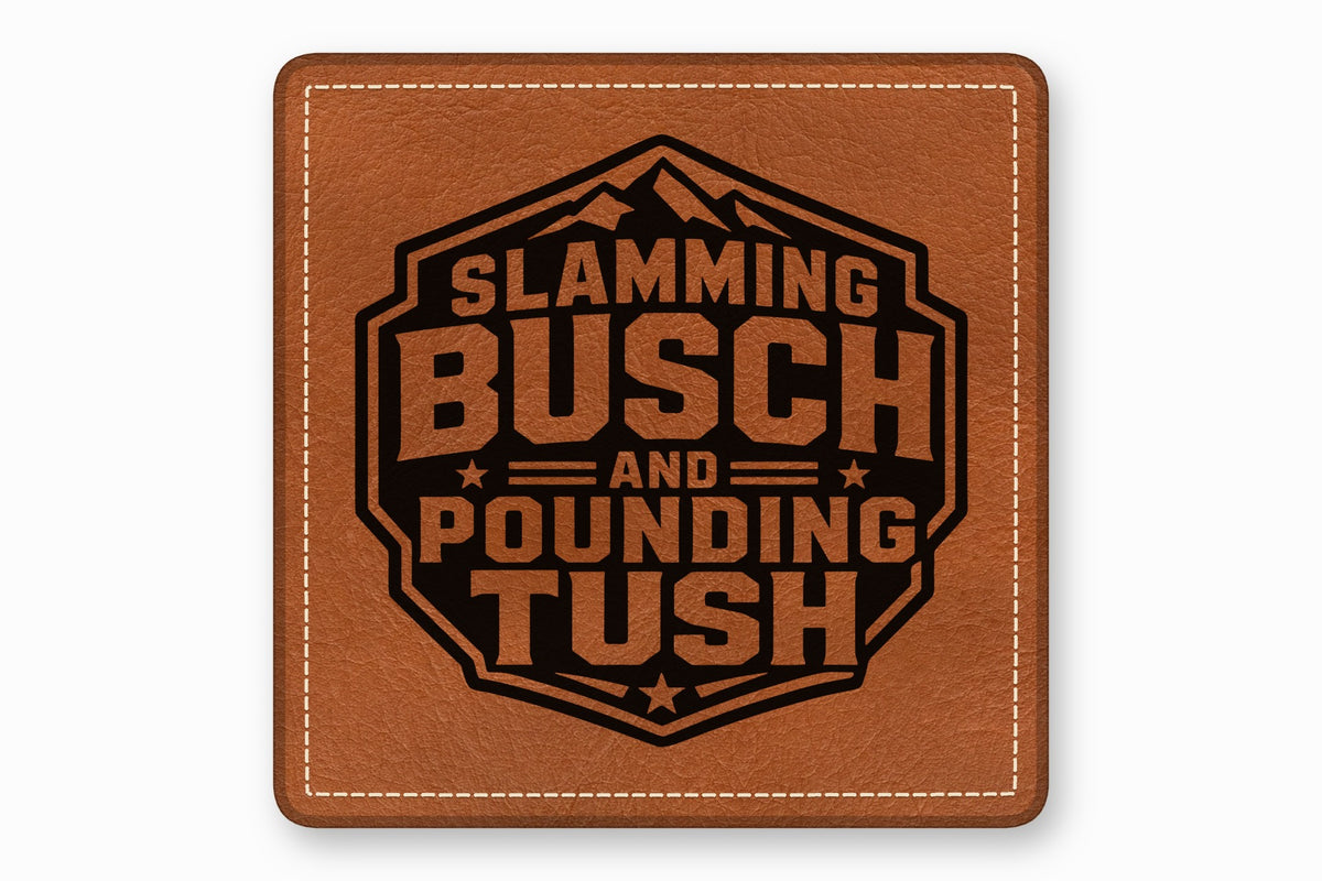 A square brown leather patch with white stitched borders and a black text graphic that reads Slamming Busch and Pounding Tush.