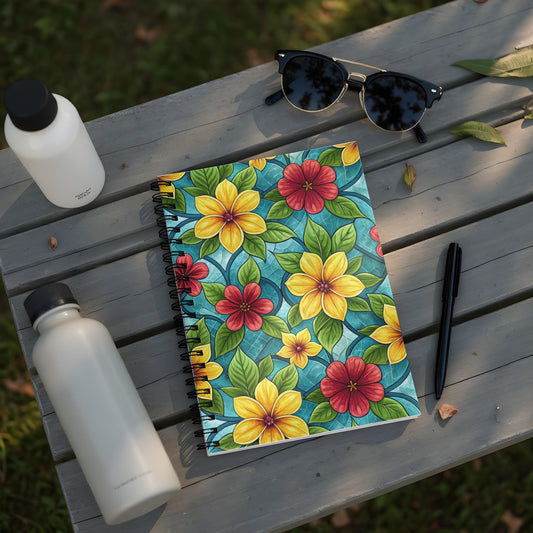 Spiral notebook with yellow and red flowers on a turquoise background.