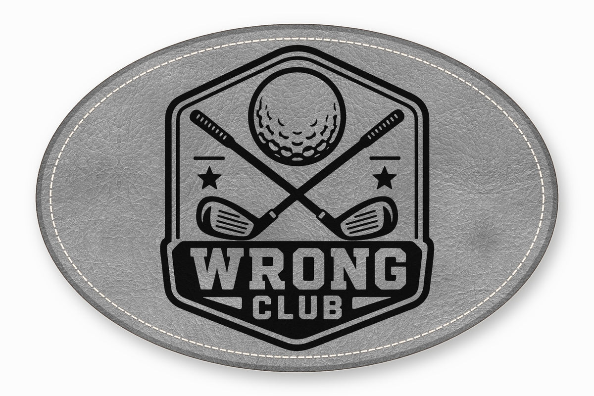 An oval grey leather patch with white stitching featuring a black golf emblem and the text WRONG CLUB.