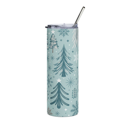 Light blue tumbler with trees, snowflakes, and stars, with a metal straw.