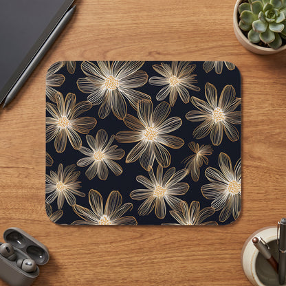 Mousepad with a gold-outlined floral pattern on a dark background.