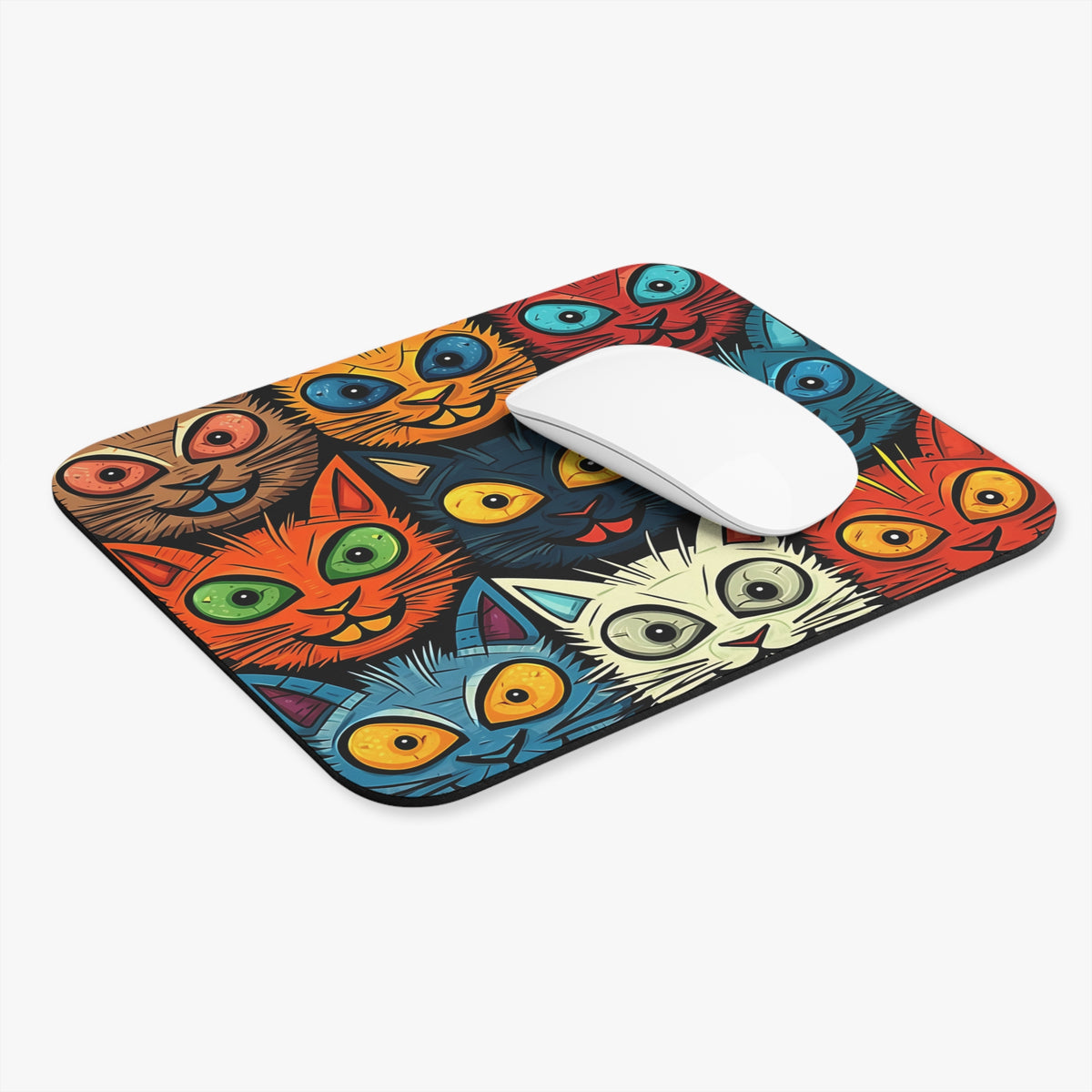 Mousepad with a colorful, cartoony pattern of many cat faces.
