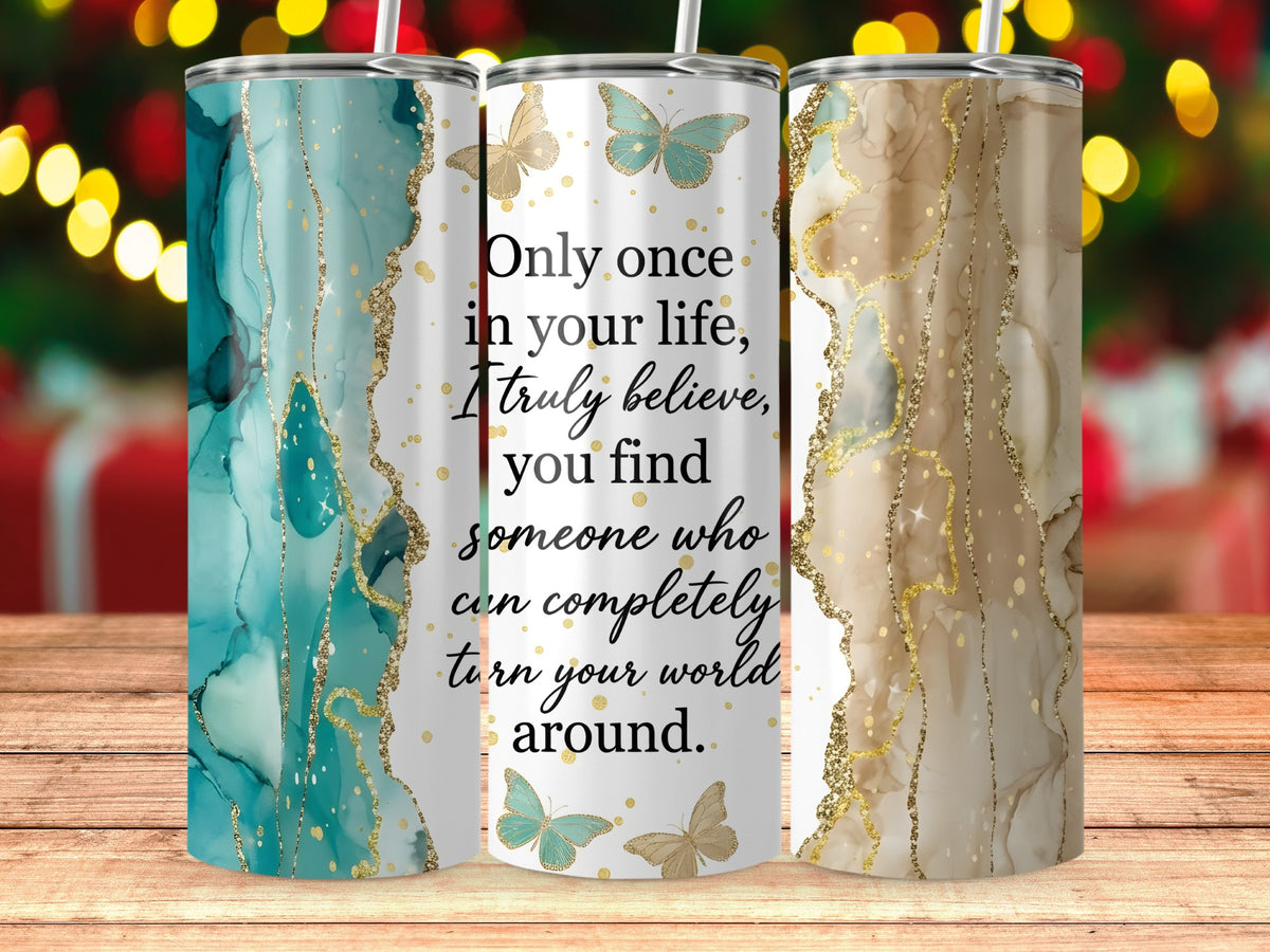 Three tumblers with abstract marble and butterfly designs, one with quote.