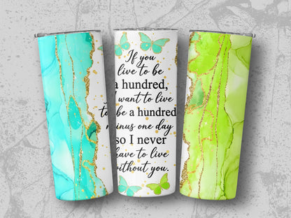 Tumblers with teal and green marble designs, gold accents, and quote about living.