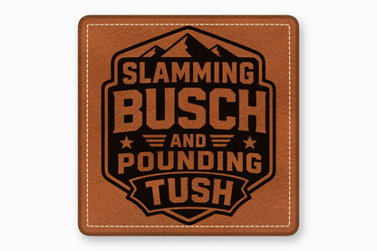 Square brown leather patch with white stitched border and a black laser-engraved mountain design with the text Slamming Busch and Pounding Tush.