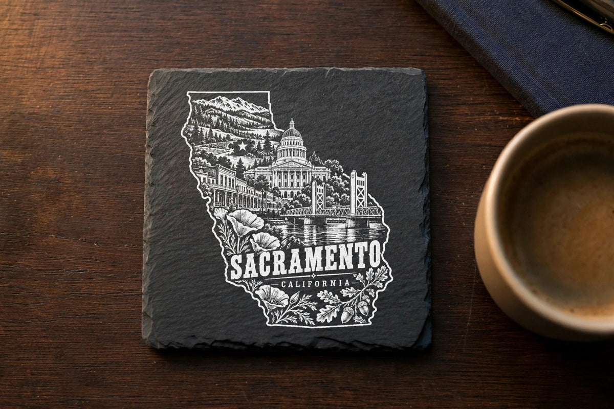 Square slate coaster featuring a white engraved map of California filled with Sacramento landmarks and text.