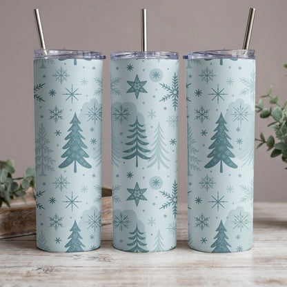 Three tumblers with a blue Christmas tree and snowflake pattern, each with a metal straw.