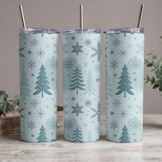 Three tumblers with a blue Christmas tree and snowflake pattern, each with a metal straw.