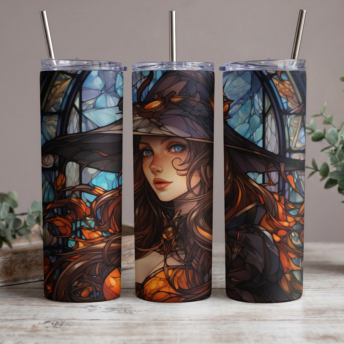 Three tumblers featuring stained glass art of a witch with blue eyes.