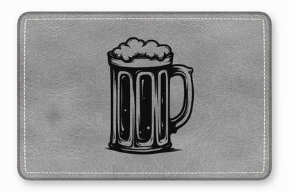 A gray faux leather bar mat featuring a black engraved illustration of a beer mug.