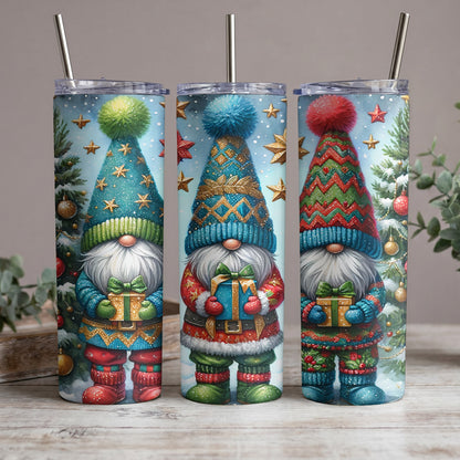 Three holiday gnomes with gifts and festive outfits on tumblers with straws.