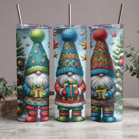 Three holiday gnomes with gifts and festive outfits on tumblers with straws.