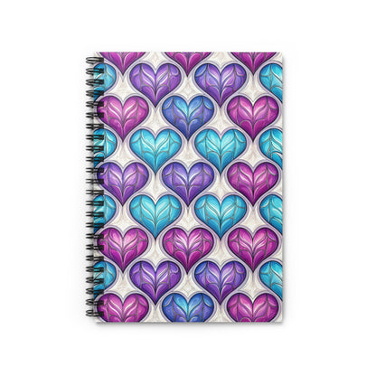Spiral notebook with a repeating pattern of colorful stained-glass hearts.