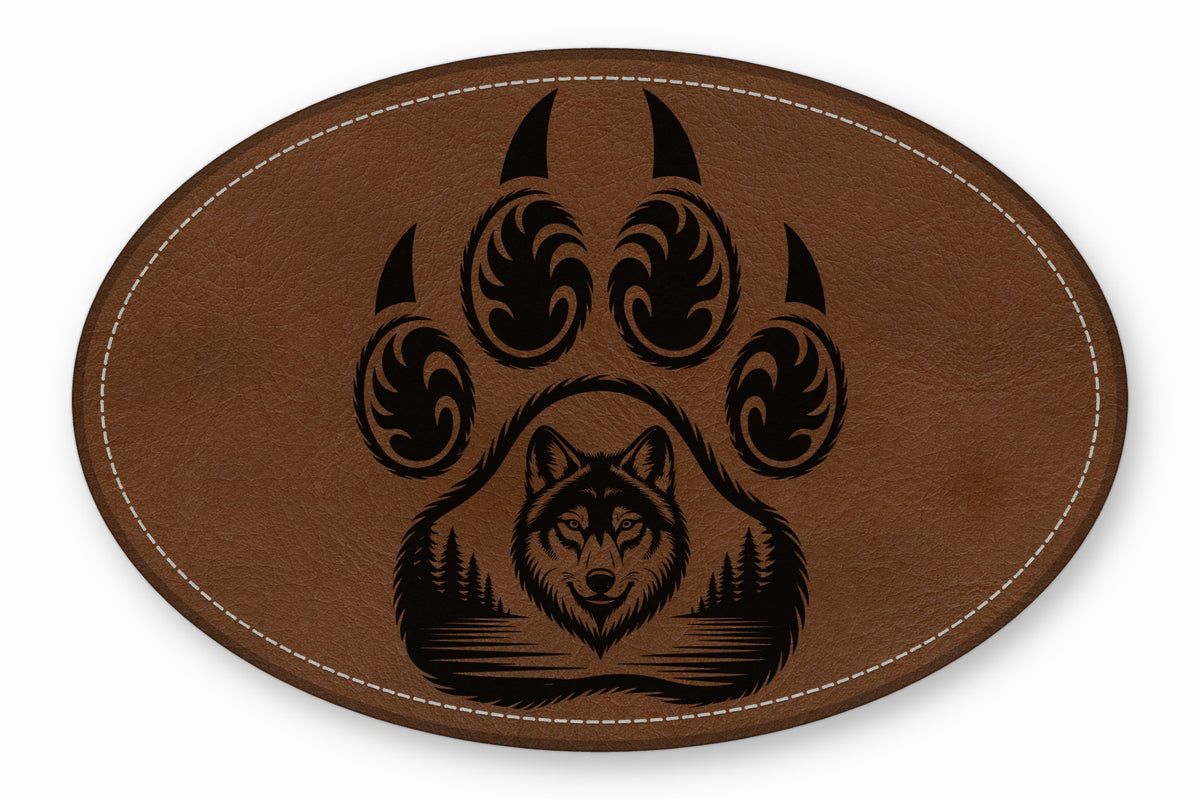 An oval brown leather patch with white stitching featuring a black bear paw and wolf graphic.