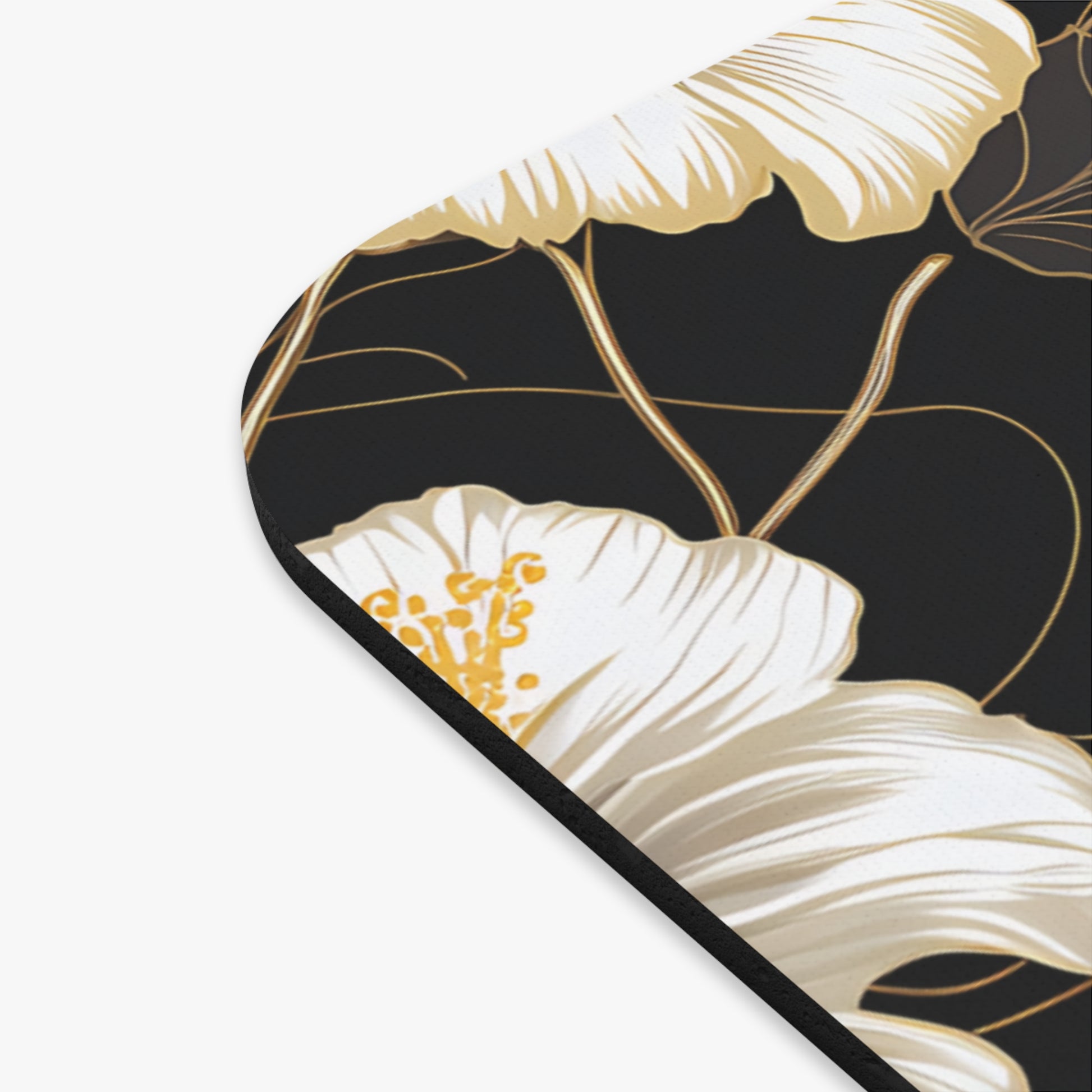 White and gold floral pattern on black background with black edging.