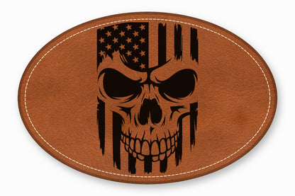 Oval brown leather patch featuring a black laser-engraved design of a skull overlaid with an American flag.