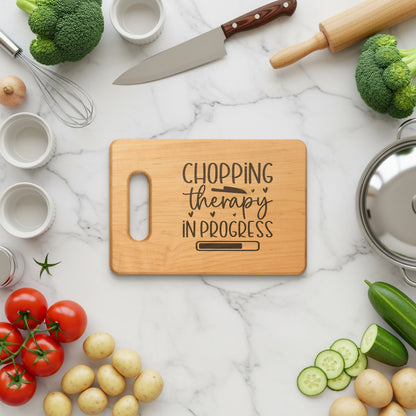 Wooden cutting board with "Chopping therapy in progress" text and a loading bar.