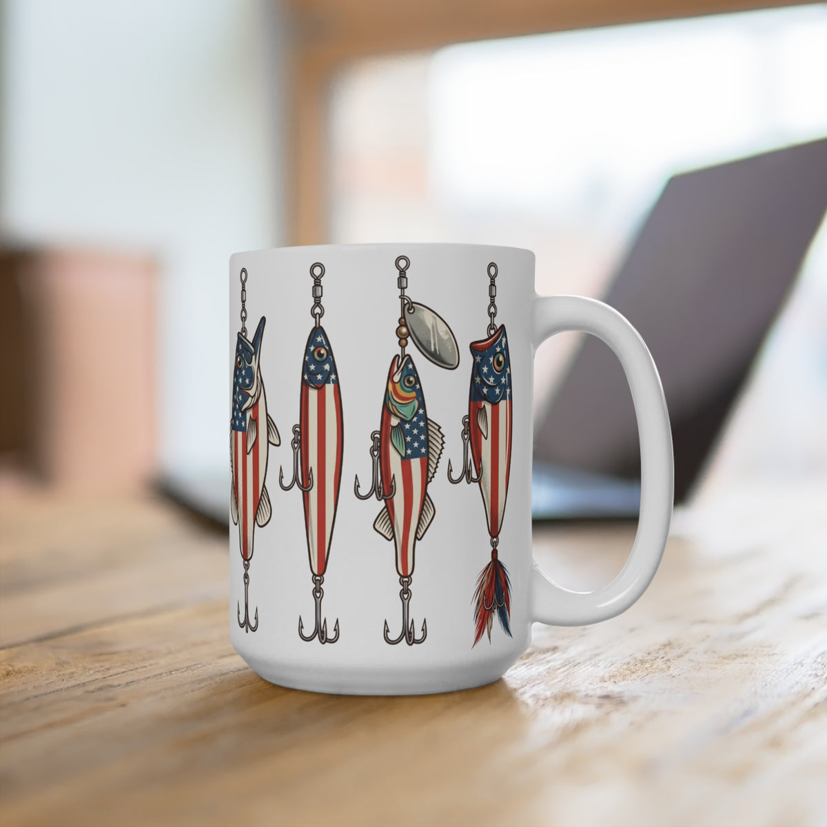White mug with patriotic fishing lure illustrations on a wooden surface.