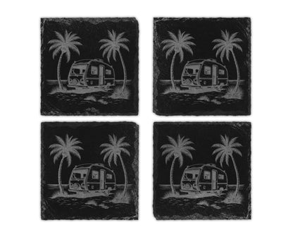 Four black slate coasters engraved with vintage campers and palm trees.