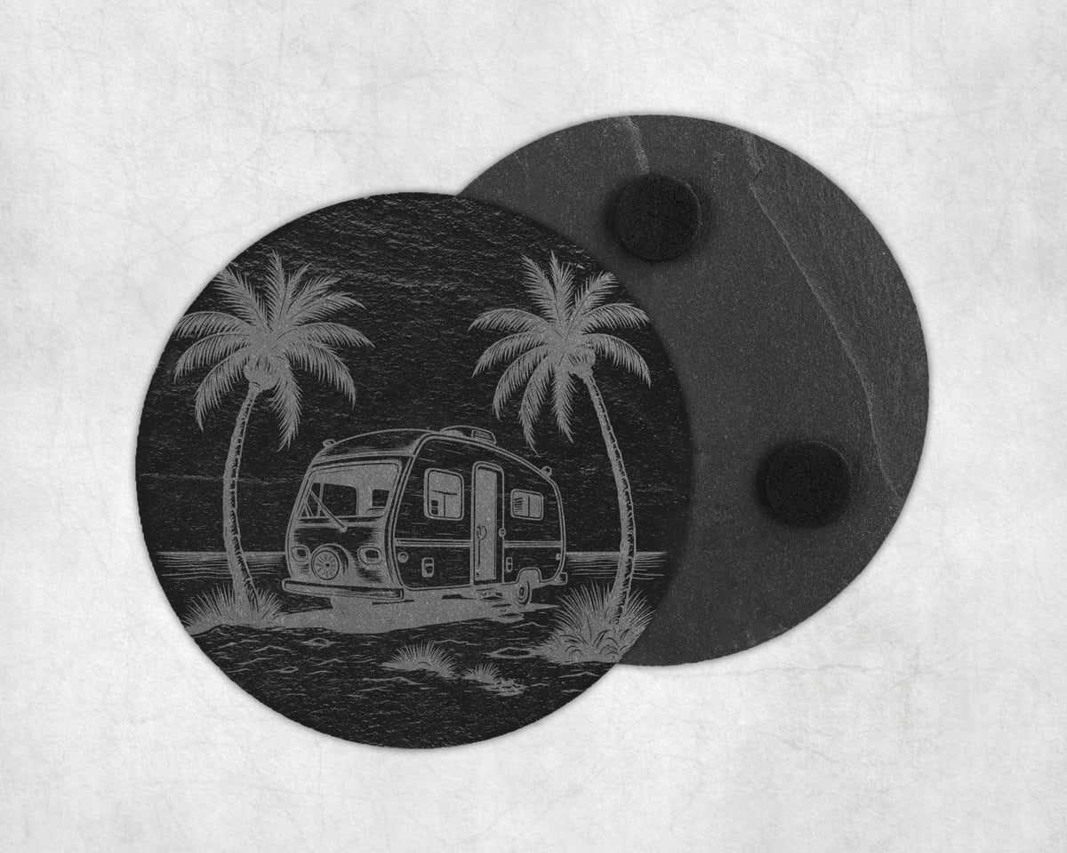 Slate coaster etched with a vintage camper and palm trees by the ocean.