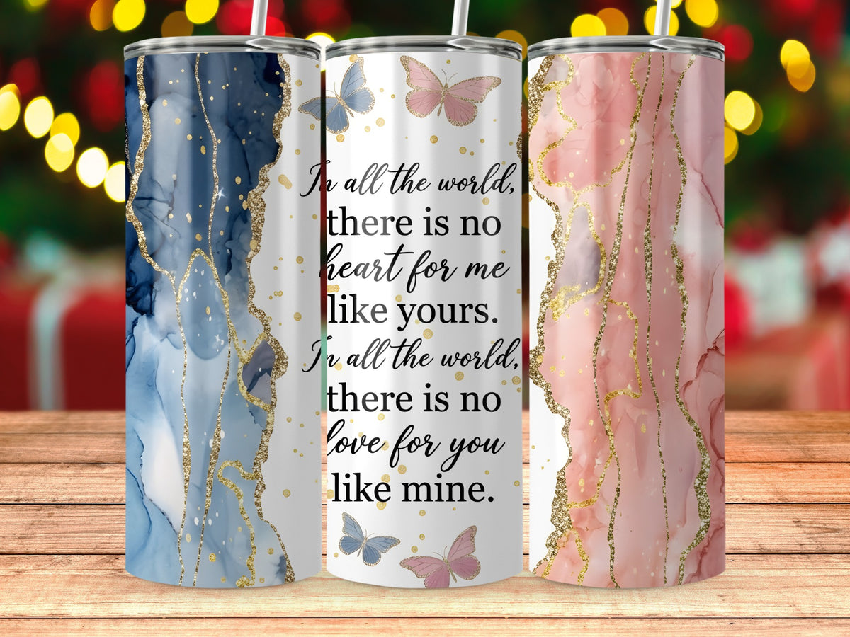 Three tumblers with marble designs and gold accents, featuring romantic text and butterflies.