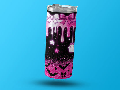 Tumbler with pink glitter, bows, drips, stars, bats, and a cute ghost.