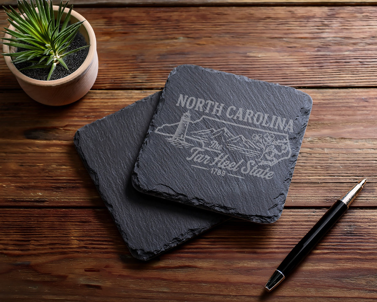 Slate coasters with North Carolina Tar Heel State design and lighthouse graphic.