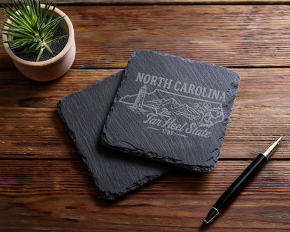 Slate coasters with North Carolina Tar Heel State design and lighthouse graphic.