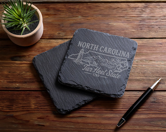 Slate coasters with North Carolina Tar Heel State design and lighthouse graphic.