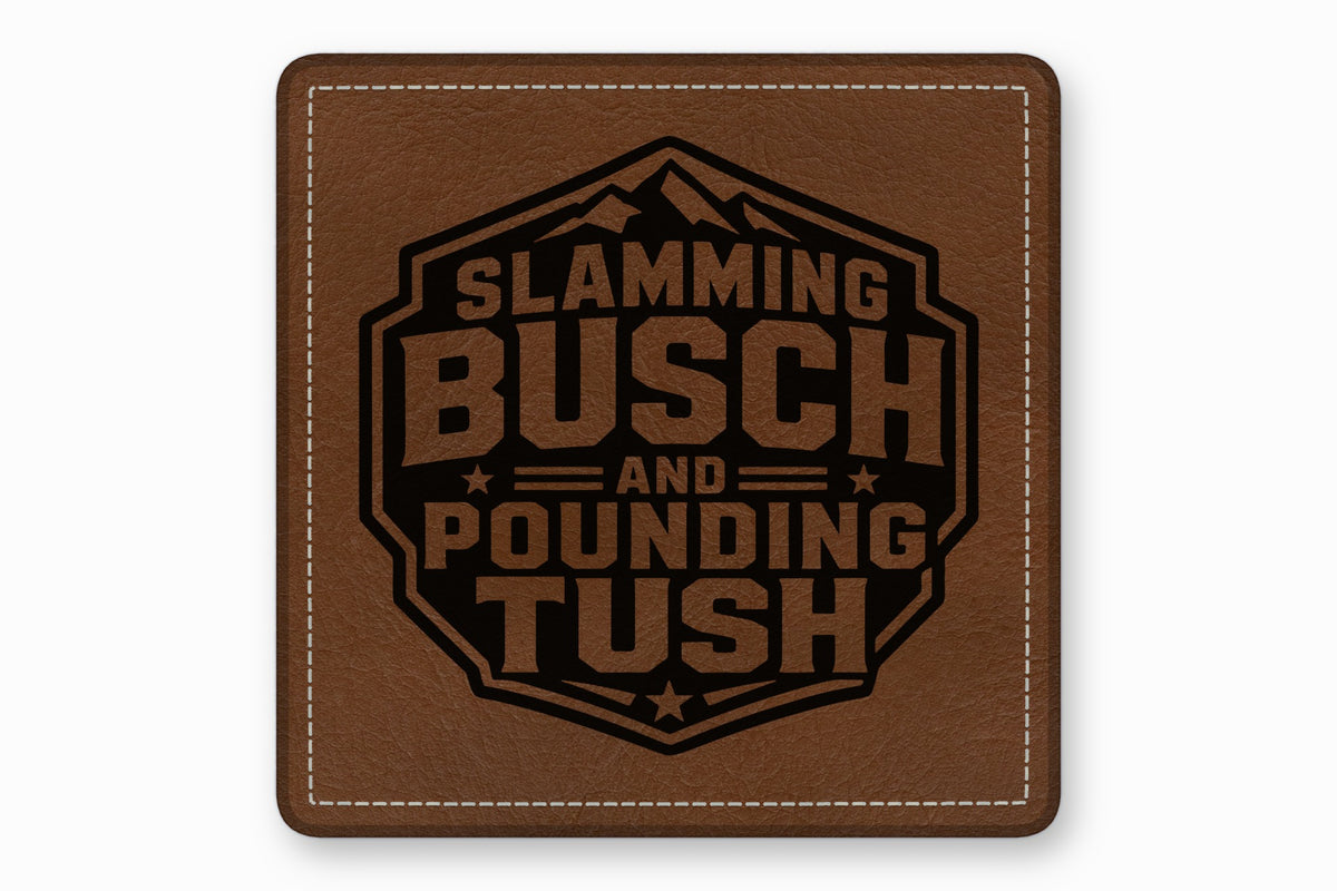 Brown leather patch with white stitched borders and a black engraved mountain design featuring the text SLAMMING BUSCH AND POUNDING TUSH.