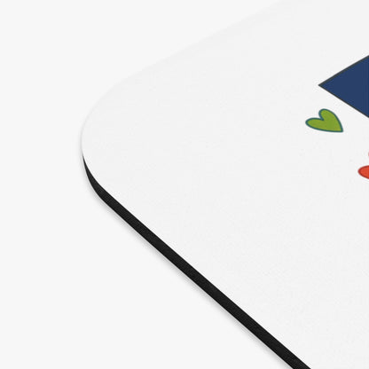 Mousepad with a blue rectangle and green and red hearts.