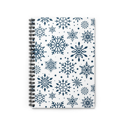Spiral-bound notebook with a white cover featuring a pattern of dark blue snowflakes.