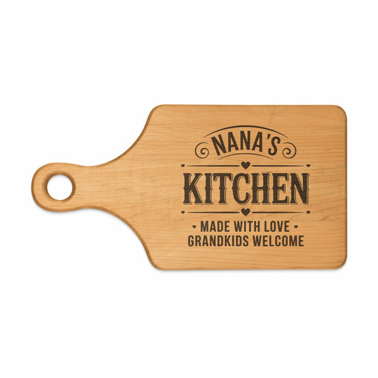 Wooden cutting board with "Nana's Kitchen" and "Made with Love, Grandkids Welcome" text.