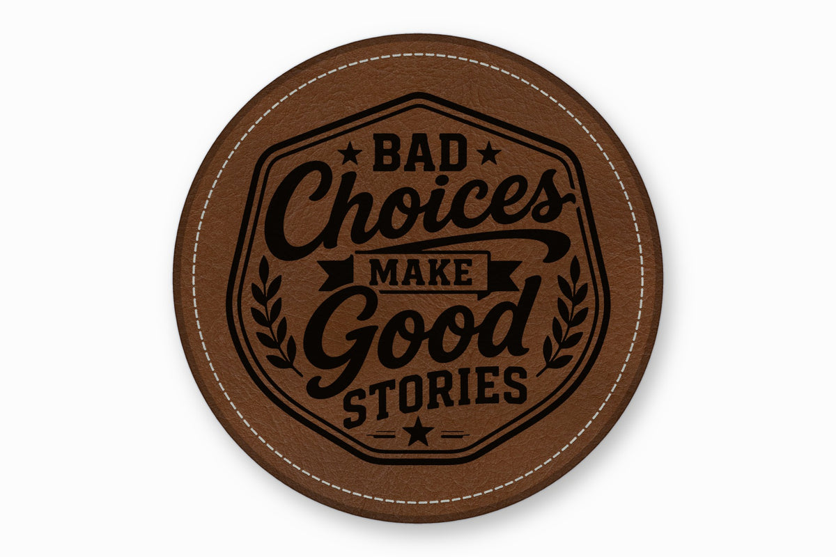 Round brown leather coaster with white edge stitching and black text reading Bad Choices Make Good Stories.